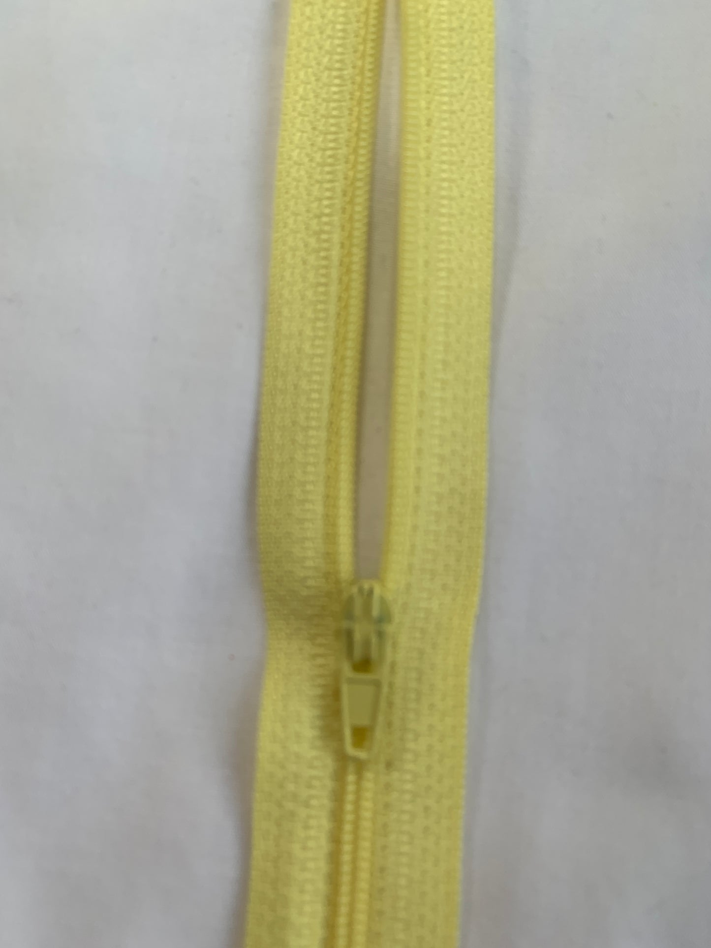 16 Inch Non-Separating Zipper, Light Yellow, Molded Plastic, New
