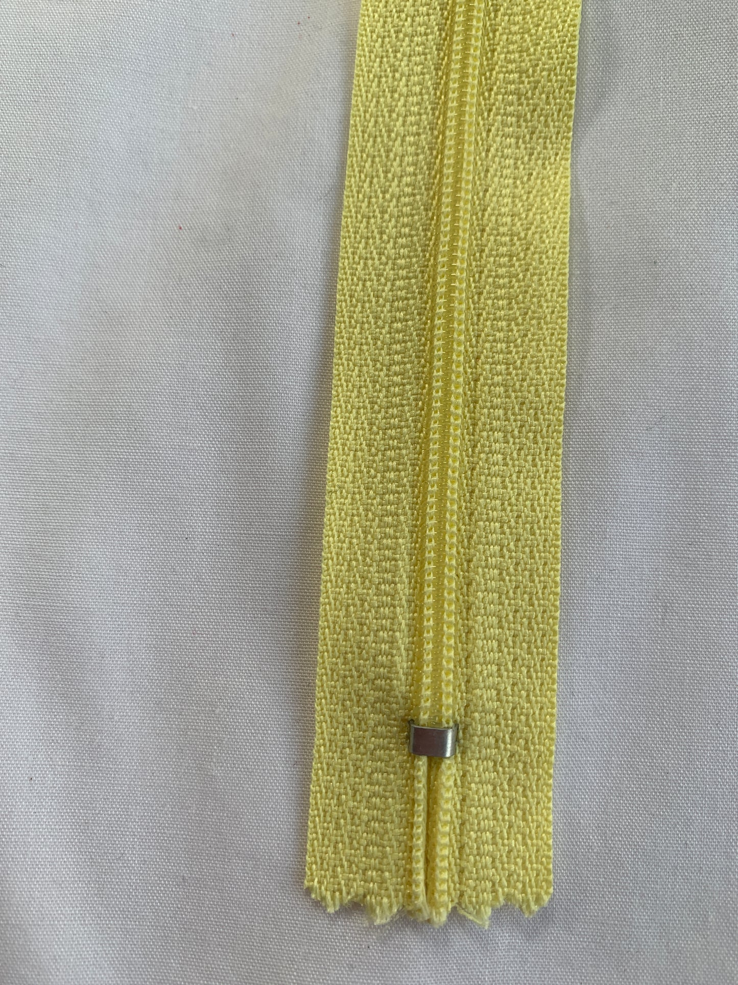 16 Inch Non-Separating Zipper, Light Yellow, Molded Plastic, New
