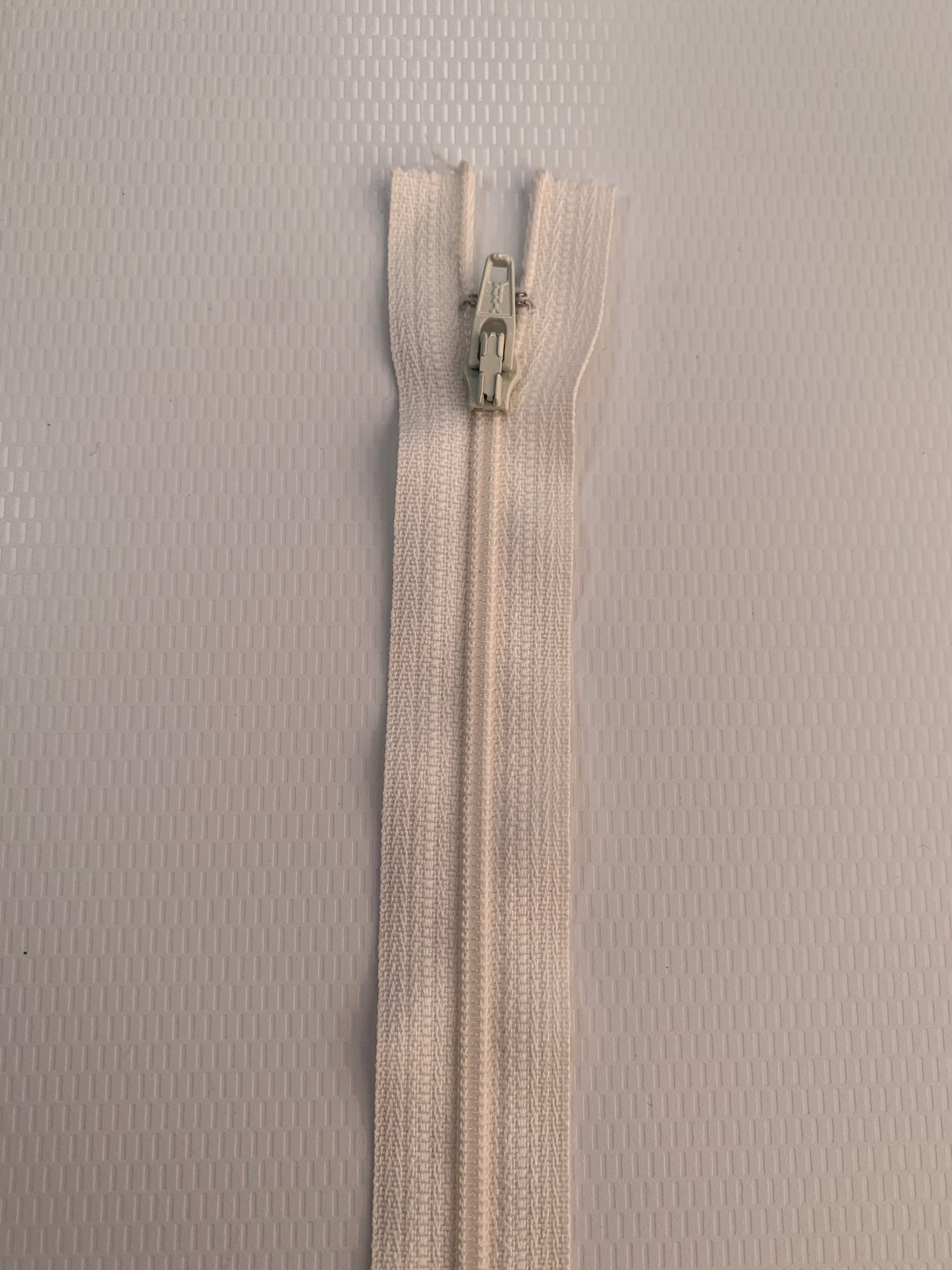 7 Inch Non-Separating Zipper, Cream Color, Molded Plastic, New