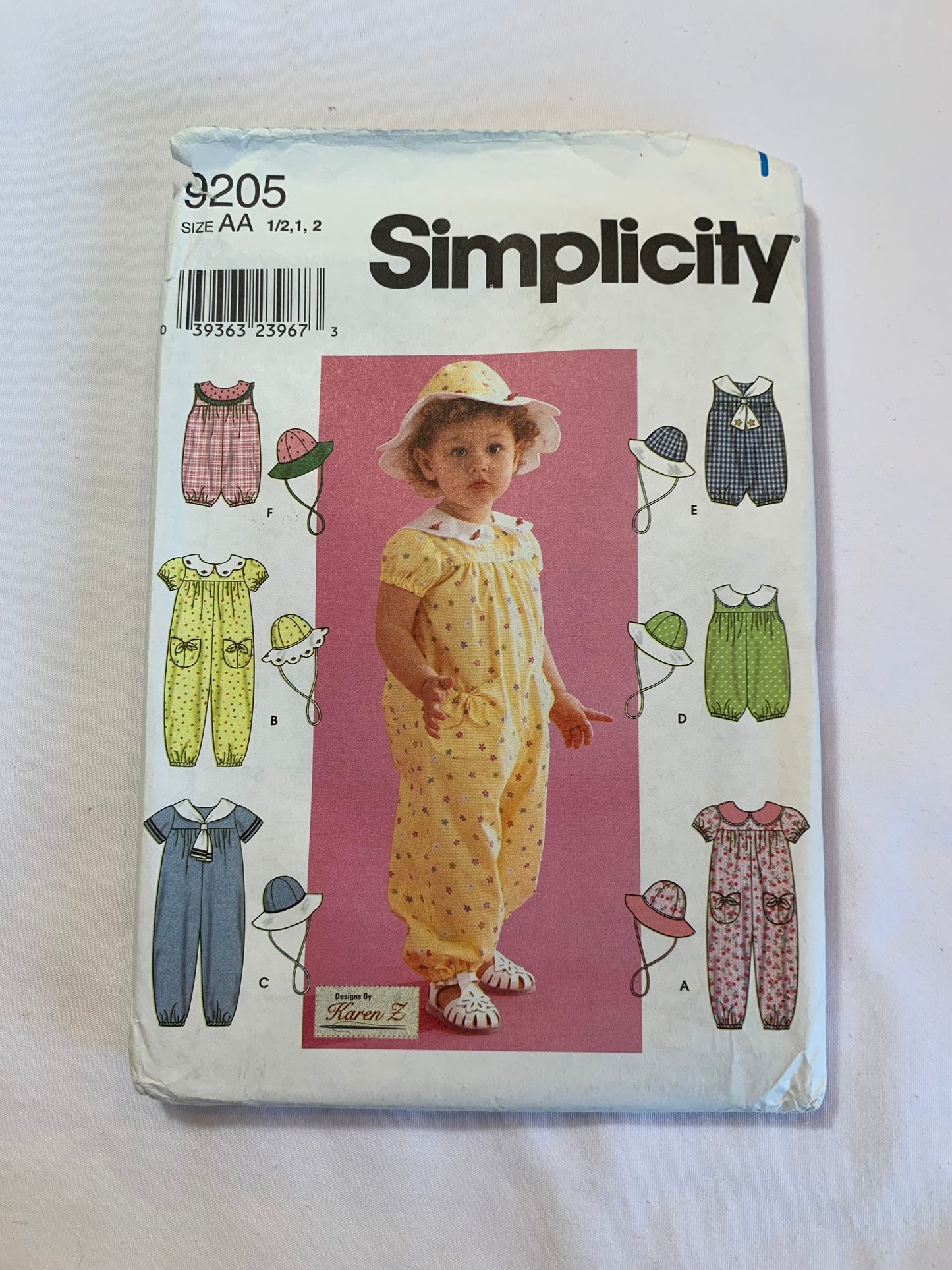 Simplicity Sewing Pattern 9205 Toddlers Romper, Hat, Sleeveless, Short Sleeves, 7 Variations, Pockets, Collar, Zipper Back, Size 1/2-2, Uncut, 2000