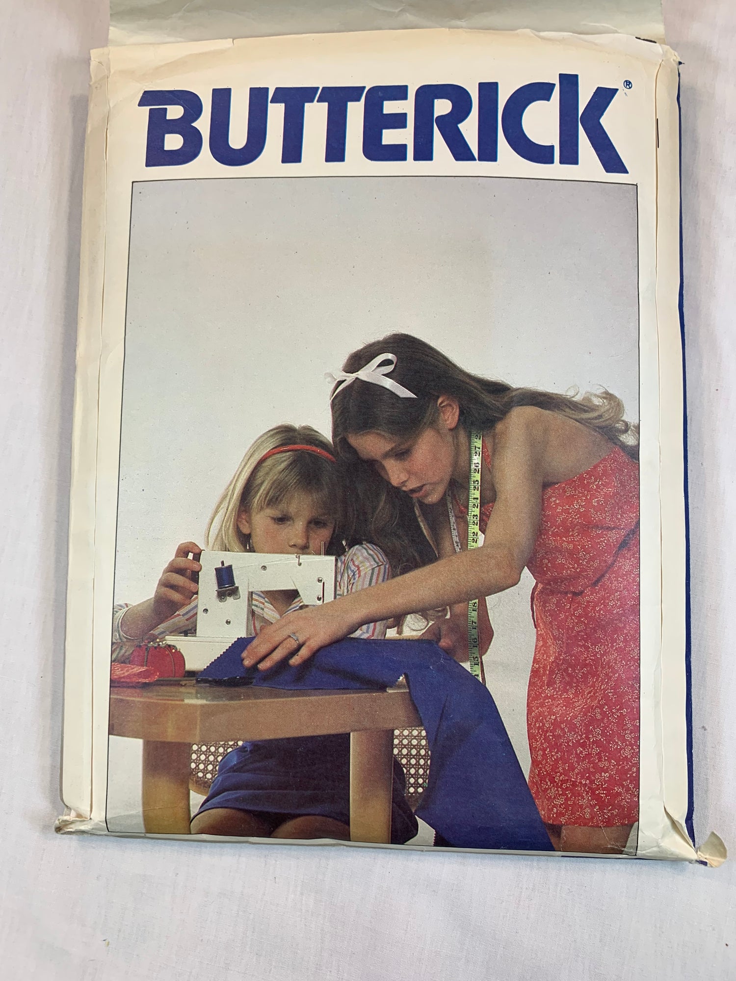 Butterick Girls' Jumper, Dress, Back Wrap, Semi-Fitted, Tie Belt, Halter Top, Above Knee Length. Size 7-14, Cut, Vintage 1990's