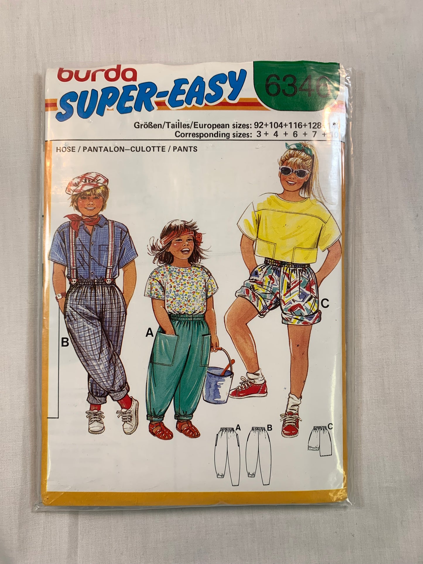 Burda Sewing Pattern 6346 Girls'/Boys' Pants, Shorts, Pockets, Elastic Waist/Ankles, Loose-Fitting, Size 3-10, Cut, 2000