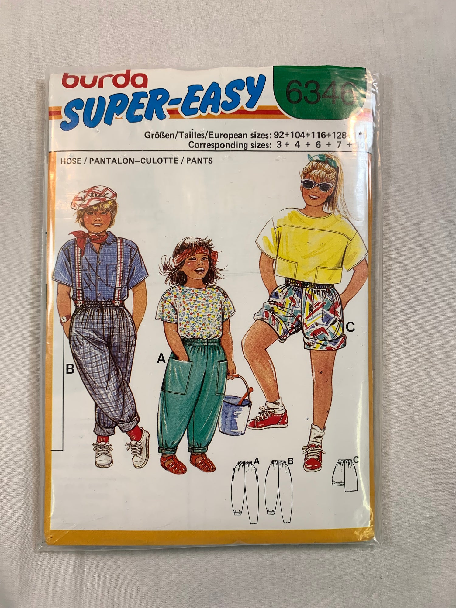 Burda Sewing Pattern 6346 Girls'/Boys' Pants, Shorts, Pockets, Elastic Waist/Ankles, Loose-Fitting, Size 3-10, Cut, 2000