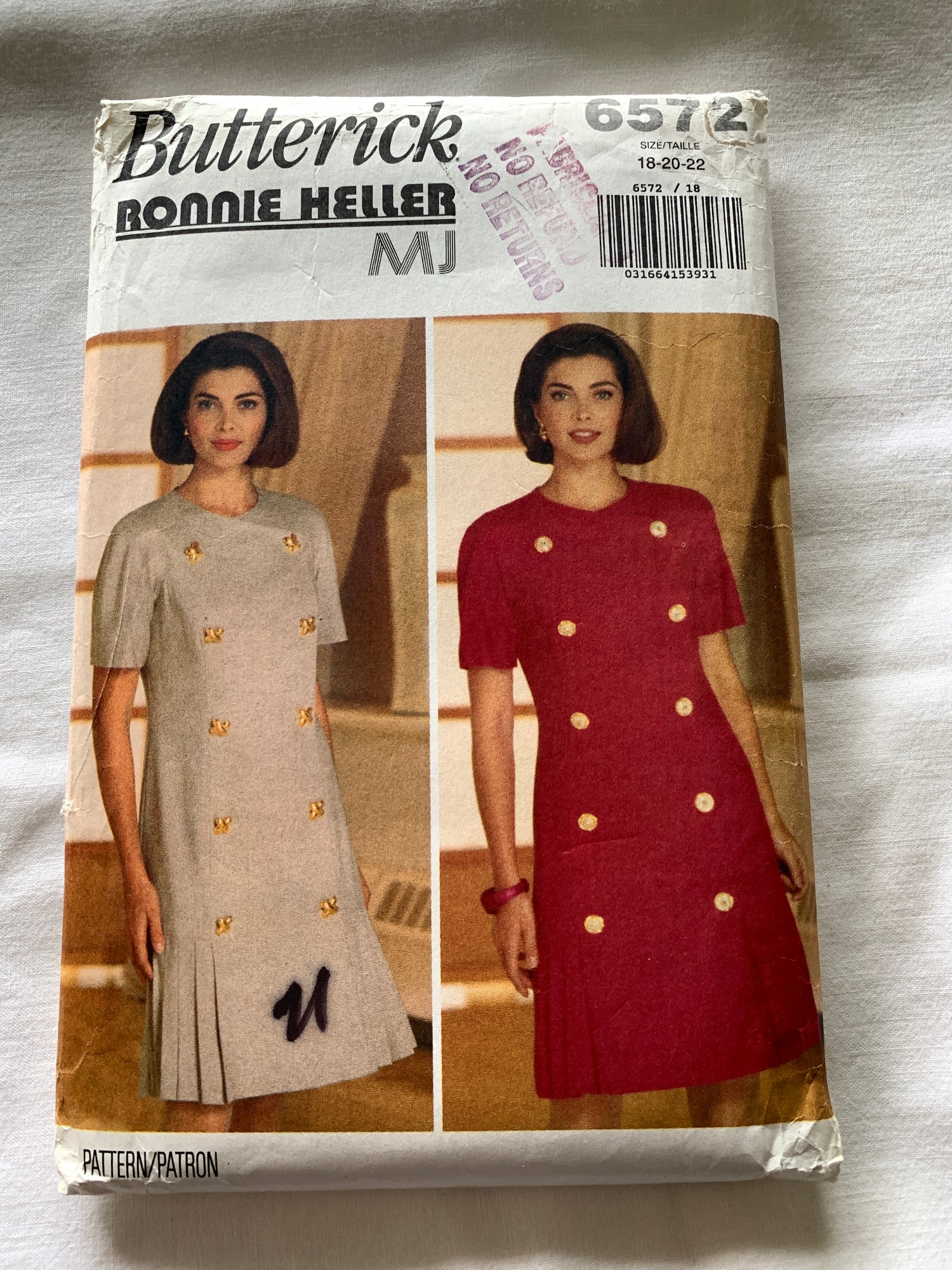 Misses' Dress: Fitted, double-breasted dress, above mid-knee, has shoulder pads, princess seams, pleated flounce and above elbow sleeves.&nbsp;