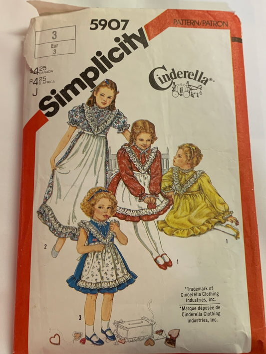 Simplicity Sewing Pattern 5907 Girls' Dress, Apron, Two Lengths, Button Back, Ruffle, Sleeveless, Long/Short Sleeves, Tie Ends, Size 3, Cut, Vintage 1983