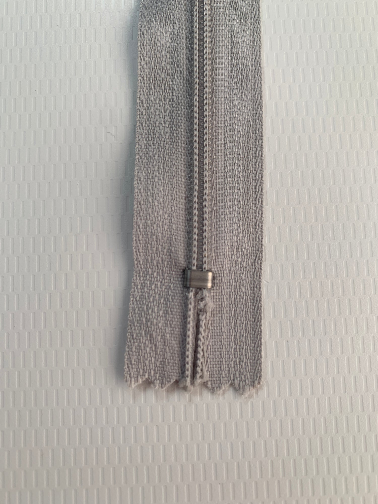 9 Inch Non-Separating Zipper, Light Gray, Molded Plastic, New