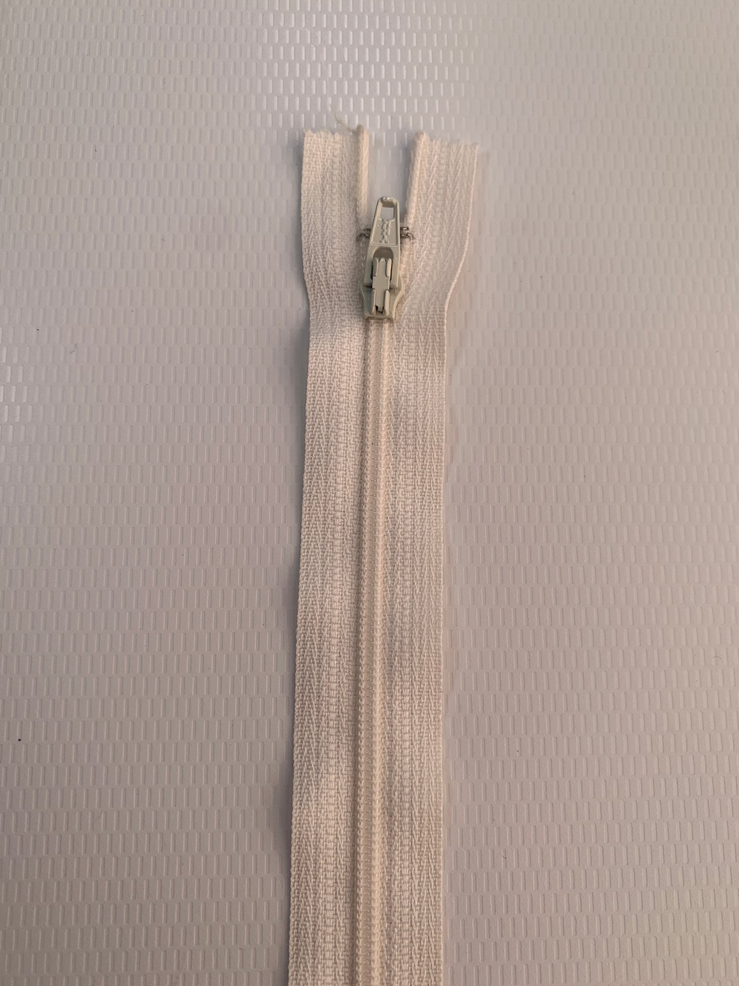 7 Inch Non-Separating Zipper, Cream Color, Molded Plastic, New