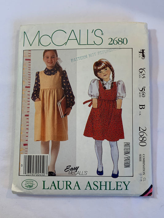 McCall's Laura Ashley Sewing Pattern 2680 Girls' Jumper, Blouse, 2 Variations, Loose-Fitting, Pullover, Sleeveless, Pockets, Tie Back, Button Front, Long/Short Sleeveless, Size 6-8, Cut, Vintage 1985