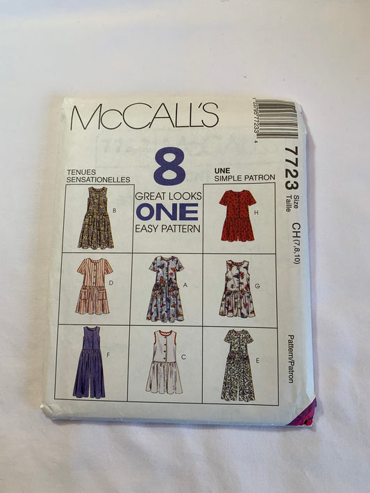 McCall's Sewing Pattern 7723 Girls'/Children's Dress, Jumpsuit, Rompers, Pockets, Loose Fitting, Short Sleeves, Sleeveless, Two Lengths, Size 7-10, Cut, Vintage 1996