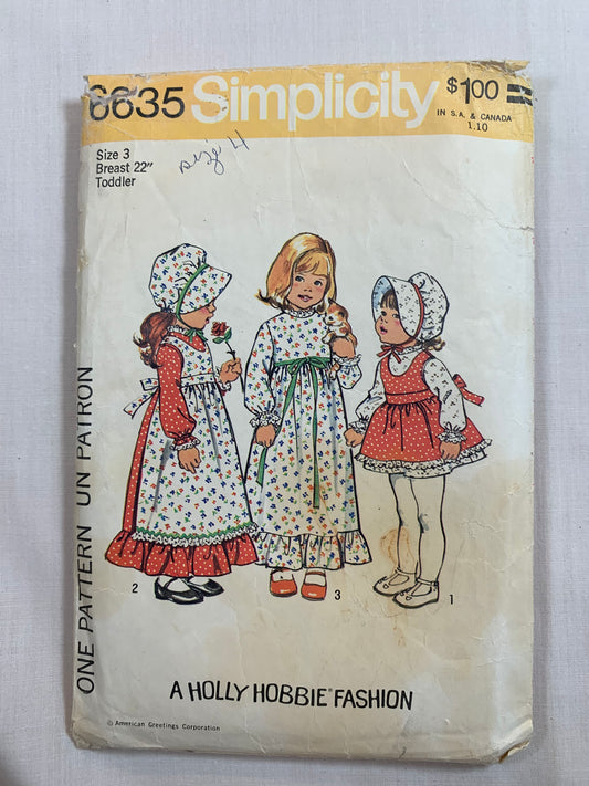 Simplicity Holly Hobby Sewing Pattern 6635 Toddlers'/Girls' Dress, Apron, Bonnet, Two Lengths, Zipper/Button Back, Ruffle, Sleeveless, Long Sleeves, Tie Ends, Size 3, Cut, Vintage 1974